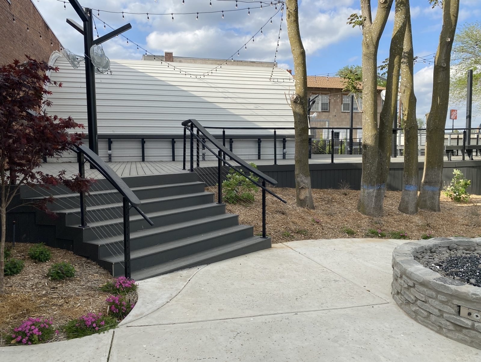 Deck stairs and stone fire pit
